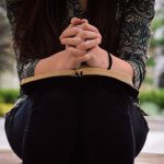 Woman holding Bible and praying